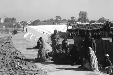 Evacuated residents in makeshift refugee shelters during the Union Carbide Disaster in Bhopal