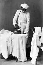 Colonial era Dhobi irons various Clothes using a Charcoal Iron