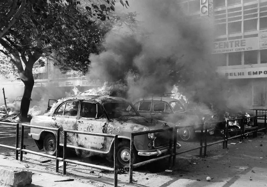 Cars parked on Sansad Marg, New Delhi, burning during the riots after the assassination of Prime Minister Indira Gandhi