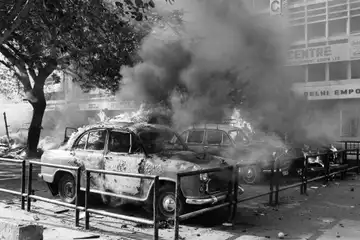 Cars parked on Sansad Marg, New Delhi, burning during the riots after the assassination of Prime Minister Indira Gandhi