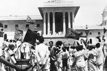 Muslim League protestors wave black flags at members of the first Cabinet of the Interim Government of India